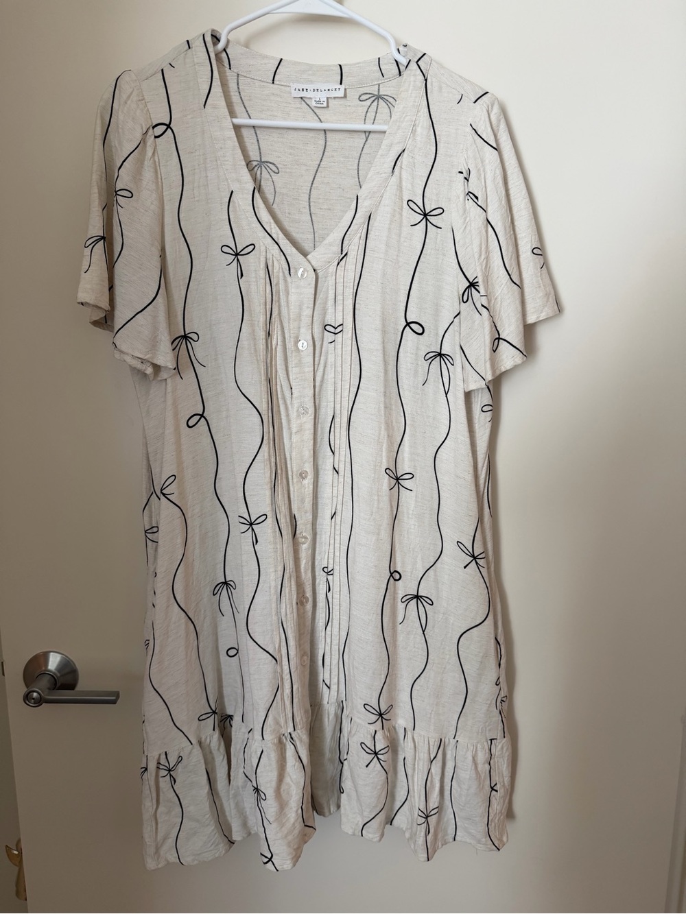 Light Beige Button-Front Short Sleeve Dress with Black Bow Print